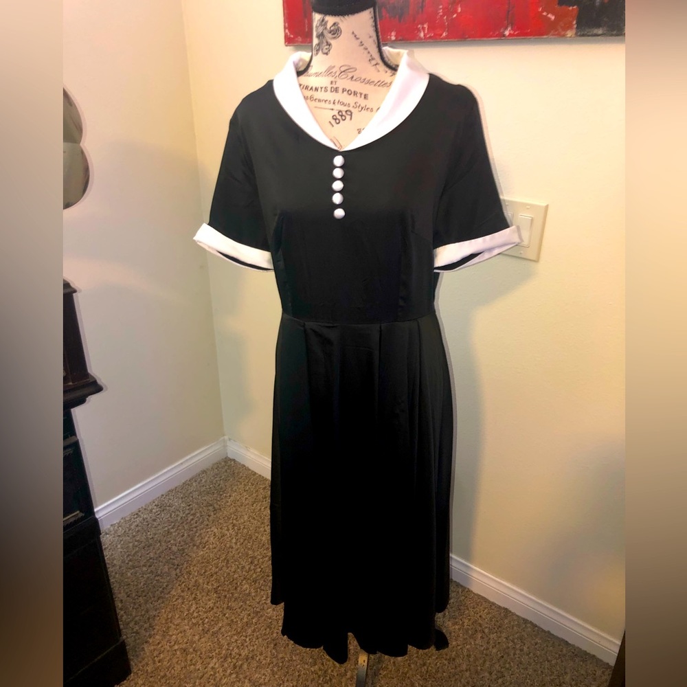Classic, never-worn, 50s style swing dress. Midi length, black with white collar